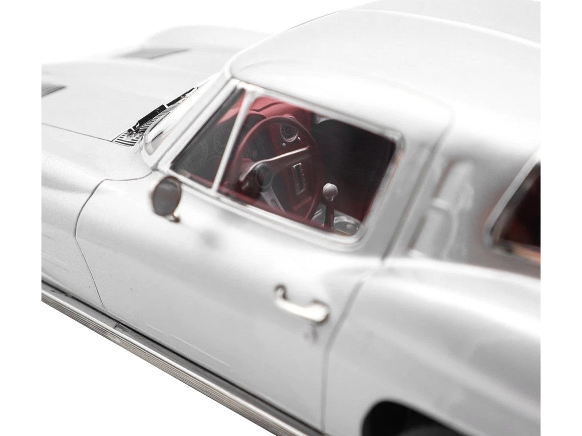 1963 Chevrolet Corvette Sting Ray Sebring Silver Metallic with Red Interior 1/18 Diecast Model Car by Norev