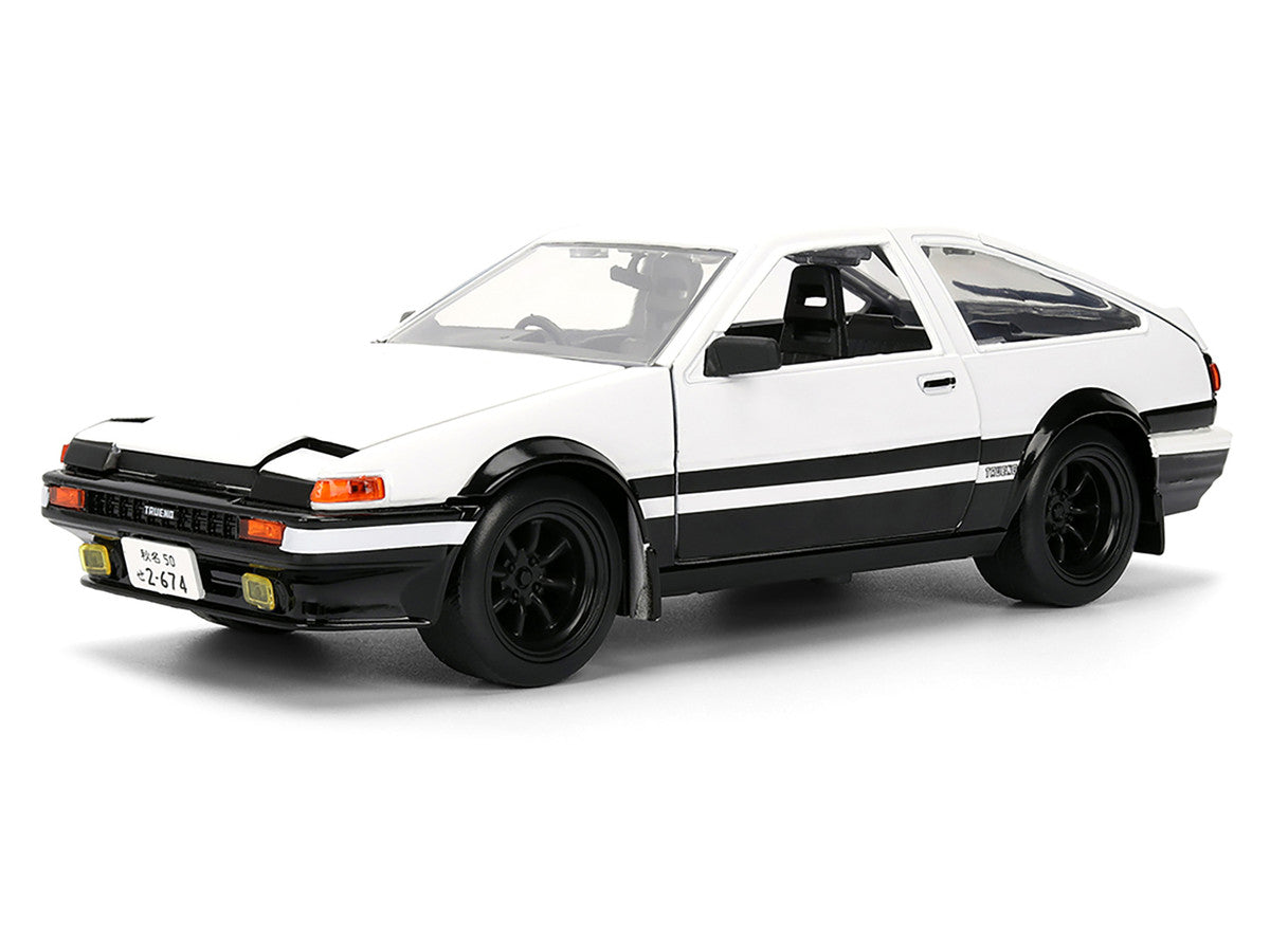 Toyota Trueno (AE86) RHD (Right Hand Drive) White and Black with Graphics and Takumi Diecast Figure "Initial D" (1998-2021) TV Series "Anime Hollywood Rides" Series 1/24 Diecast Model by Jada