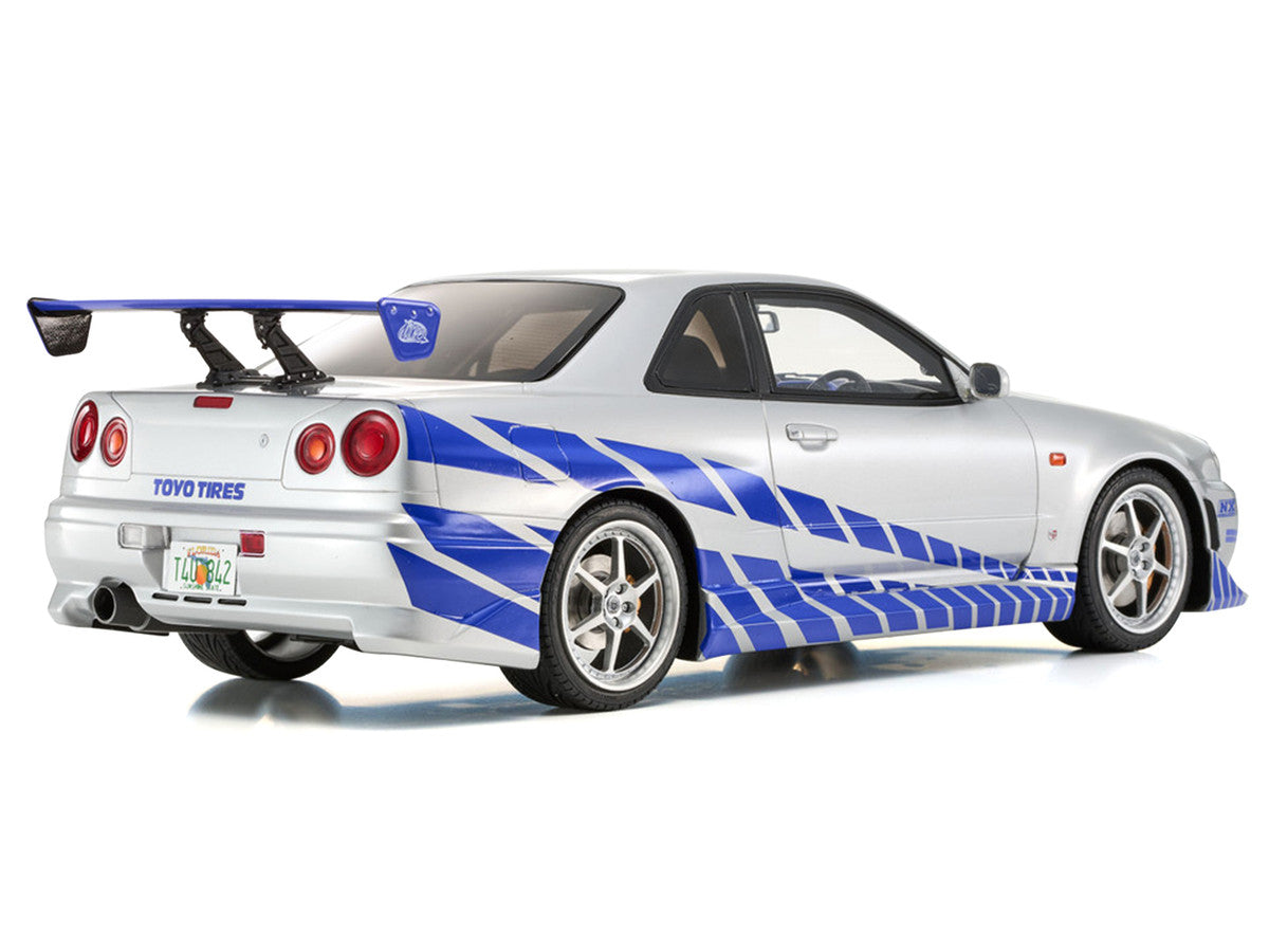 Nissan Skyline GT-R (R34) RHD (Right Hand Drive) Silver Metallic with Blue Graphics "2 Fast 2 Furious" (2003) Movie 1/12 Model Car by Kyosho