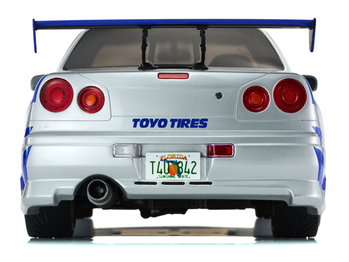 Nissan Skyline GT-R (R34) RHD (Right Hand Drive) Silver Metallic with Blue Graphics "2 Fast 2 Furious" (2003) Movie 1/12 Model Car by Kyosho