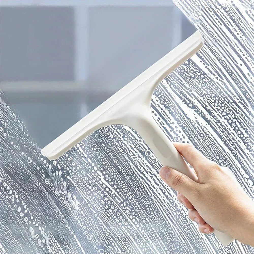 A household glass cleaning scraper that combines the functions of a watering can and a window scraper.